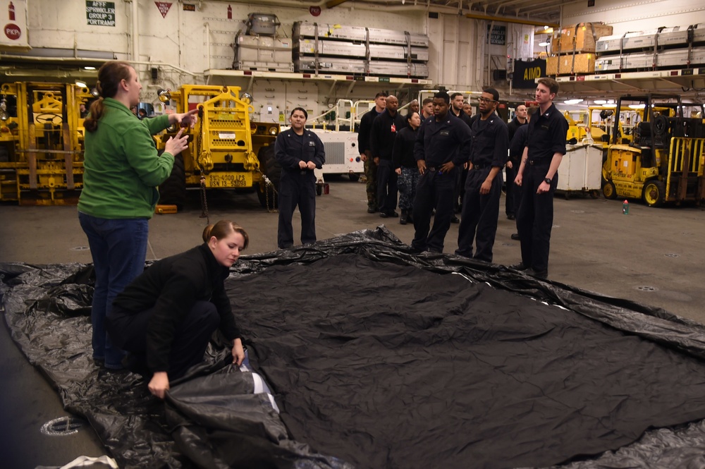 Sailors and Marines aboard USS Bonhomme Richard prep to watch Super Bowl 50