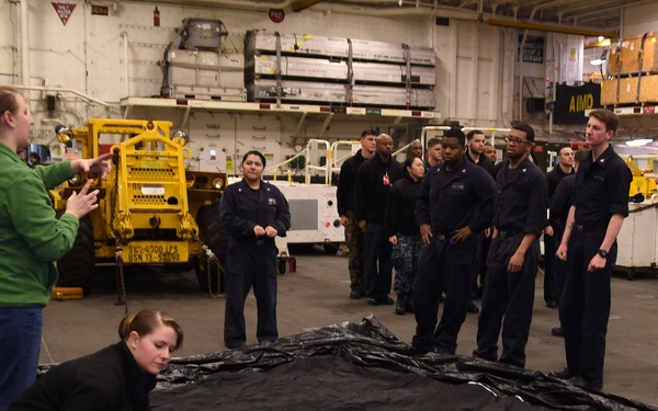 Sailors and Marines aboard USS Bonhomme Richard prep to watch Super Bowl 50