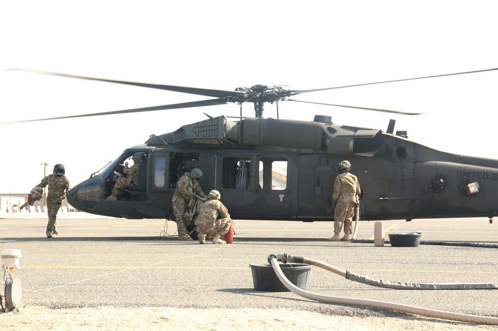 1-140th Aviation Regiment's UH-60 Black hawk helicopter receives a hot-refuel