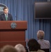 Peter Cook addresses reporters at the Pentagon