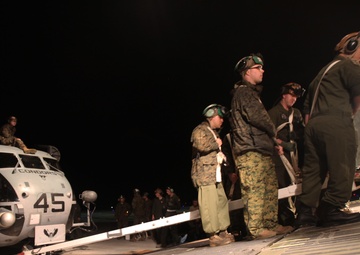 Marines with HMH-464 load CH-53Es in preparation for Operation Cold Response
