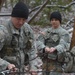 US Army military mountaineering instructor demonstrates basic skills to students