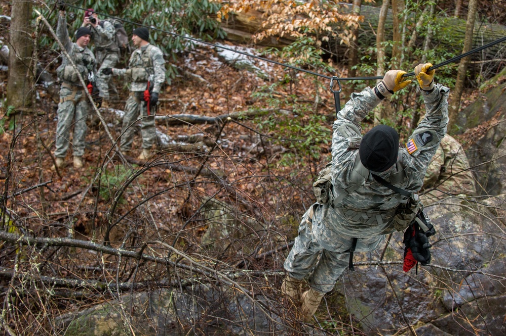 US Army Soldier crosses rope bridge