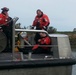 Coast Guard rescues 3 people from overturned boat
