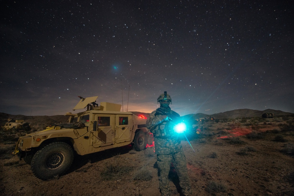 Civil affairs soldier stands guard