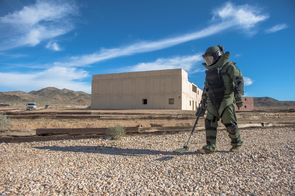 EOD technician seaches for IED