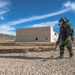 EOD technician seaches for IED