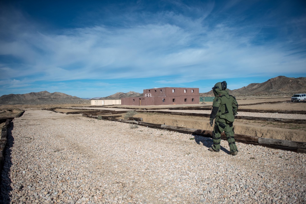 EOD technician seaches for IED