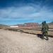 EOD technician seaches for IED