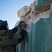 EOD technician seaches for IED