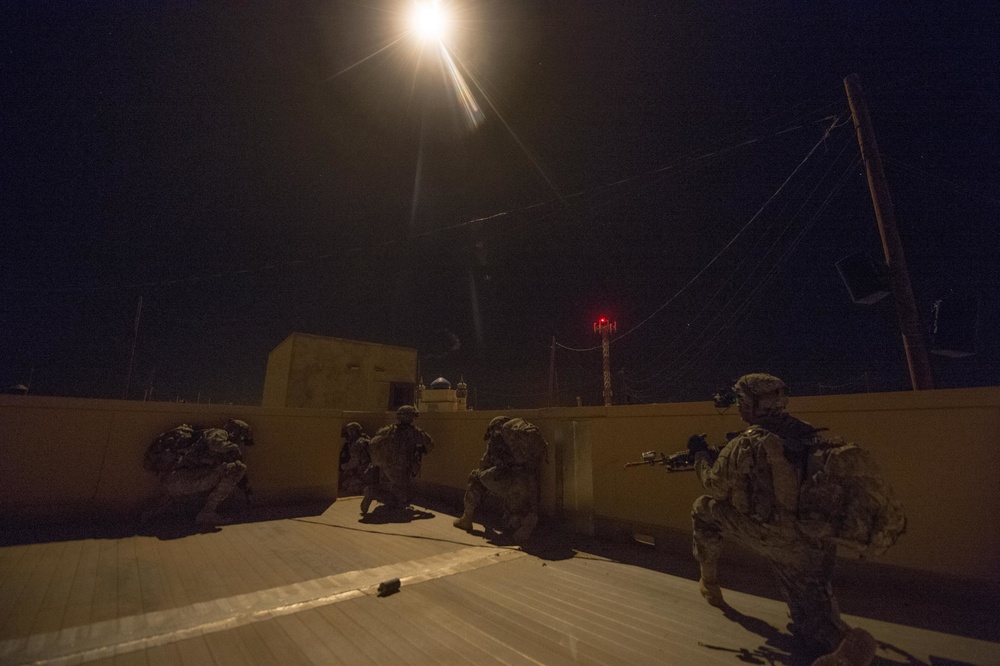 Brave Rifle Soldiers clear village