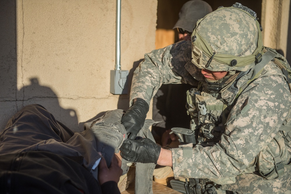 Civil affairs Soldier provides medical care to simulated patient