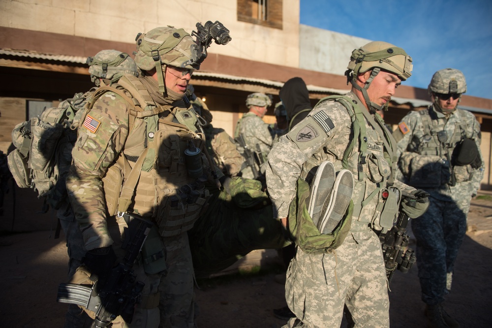 Soldiers evacuate simulated casualty