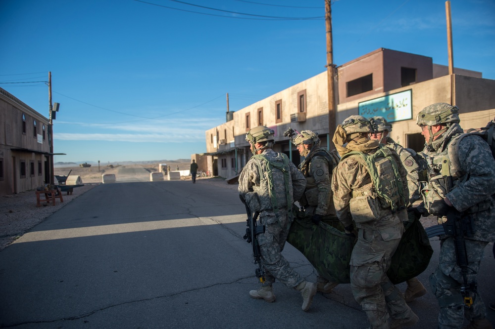 Soldiers evacuate simulated casualty