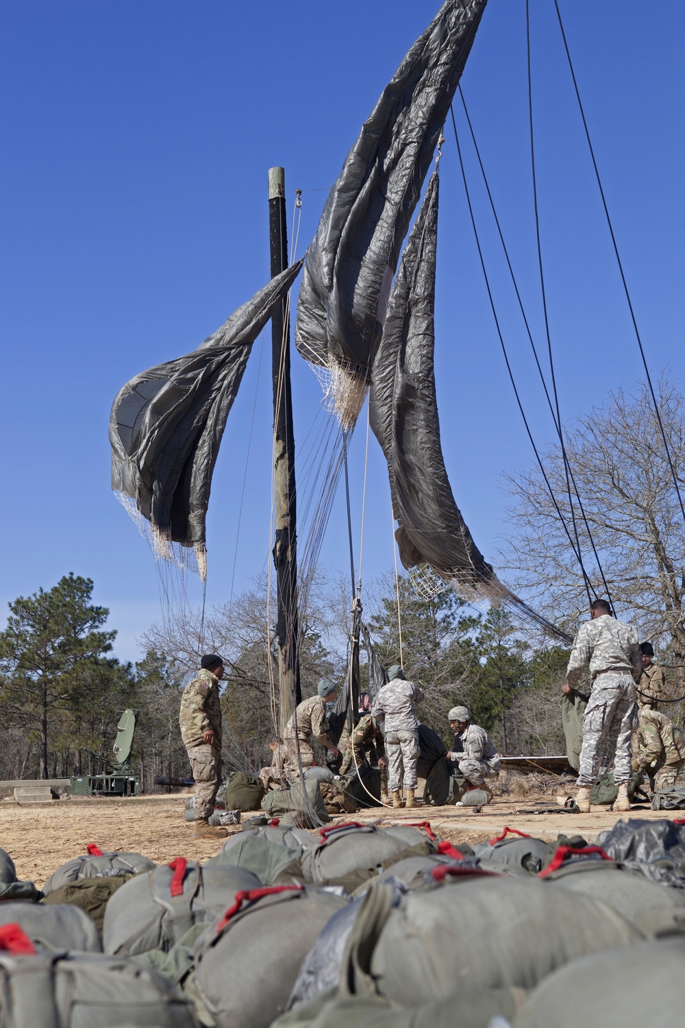 Paratroopers shake out after jump at Camp Mackall