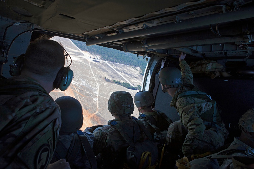 US Army paratroopers jump over Camp Mackall