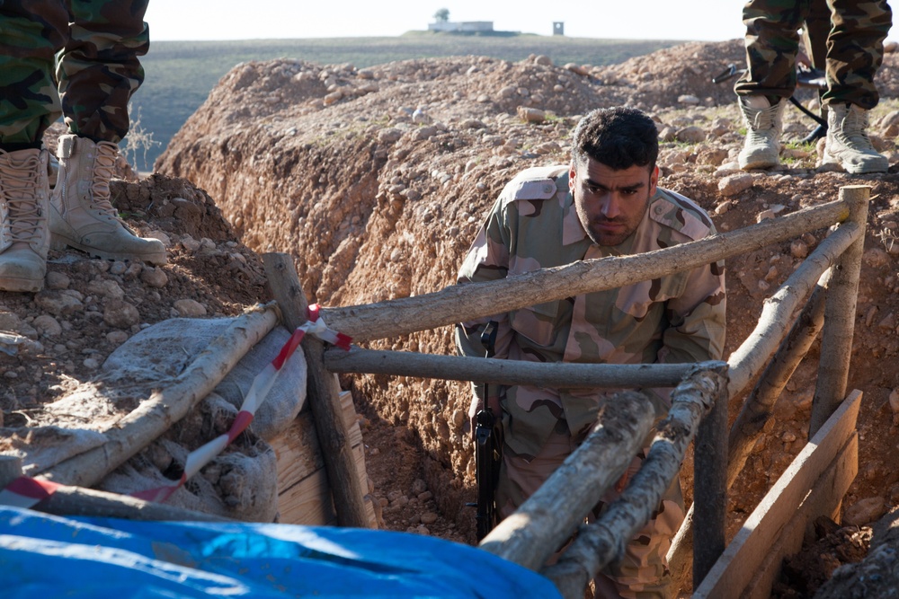 Peshmerga soldiers practice urban patrols and defense tactics under the supervision of German trainers