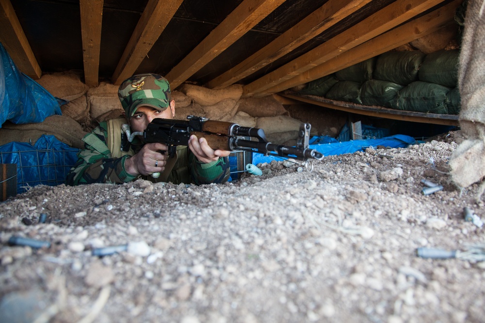 Peshmerga soldiers practice urban patrols and defense tactics under the supervision of German trainers