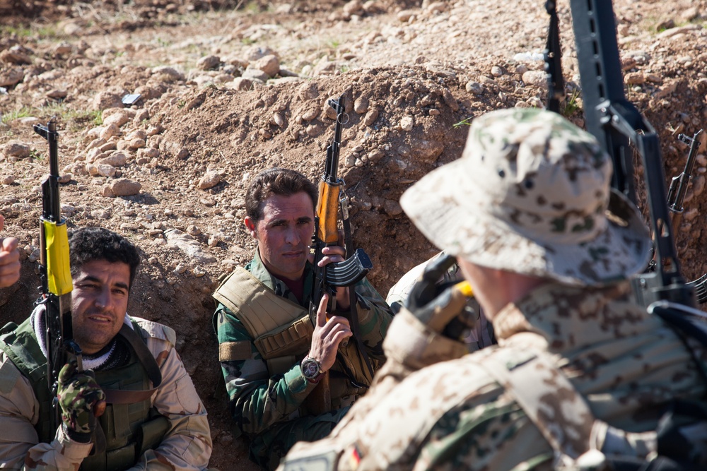 Peshmerga soldiers practice urban patrols and defense tactics under the supervision of German trainers