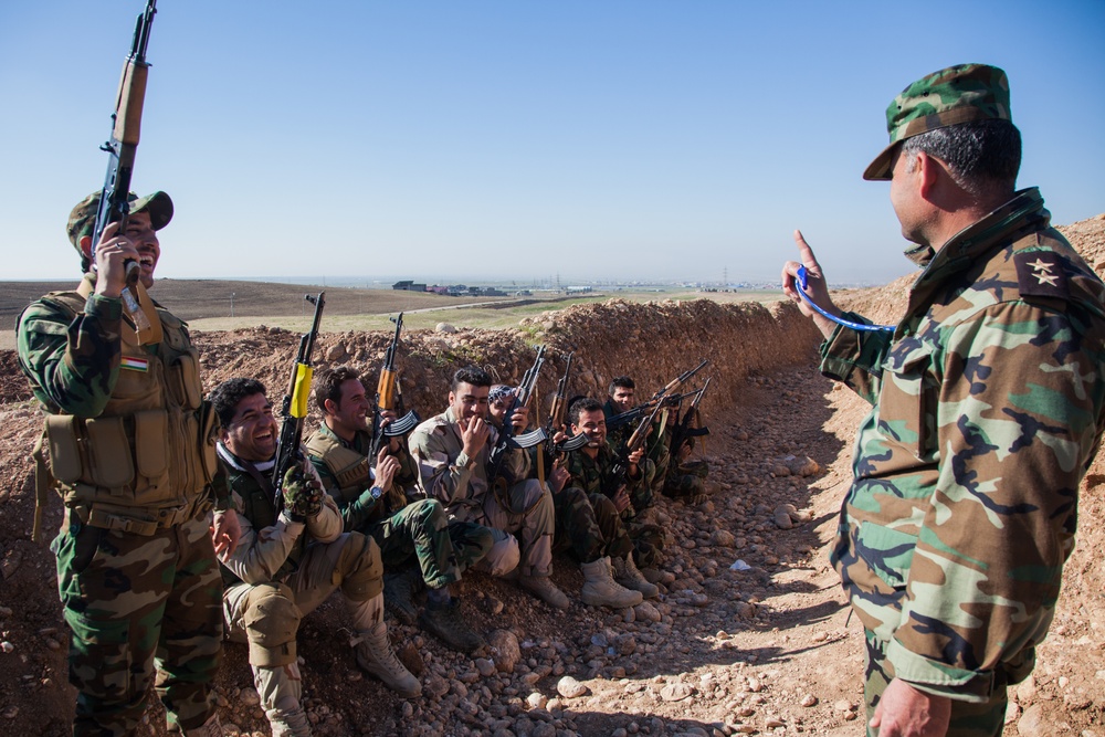 Peshmerga soldiers practice urban patrols and defense tactics under the supervision of German trainers