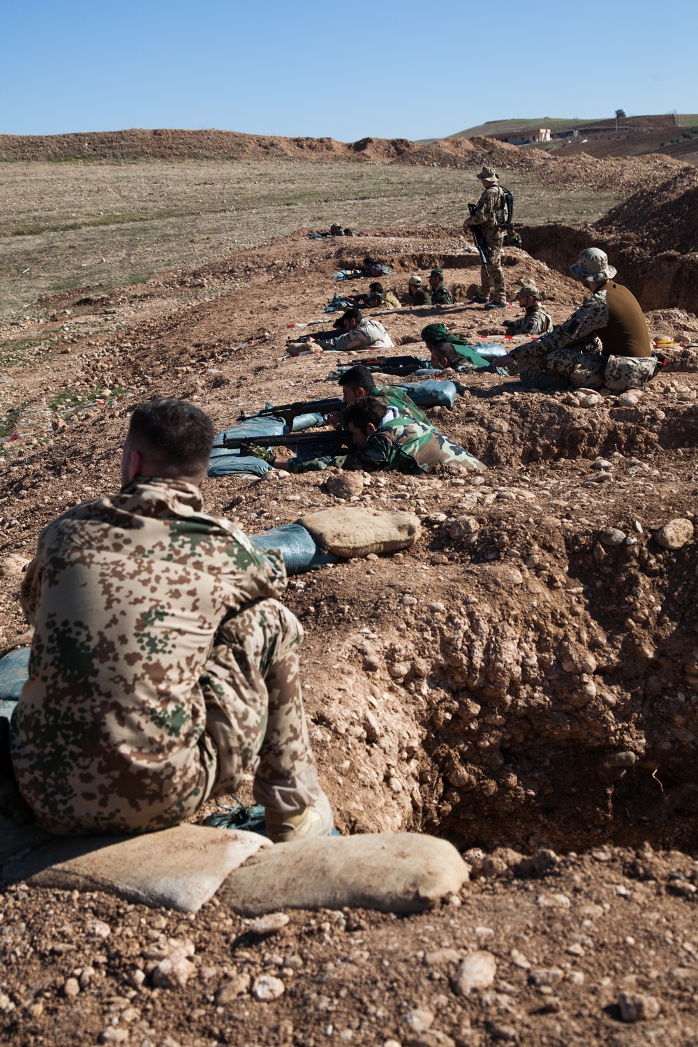 Peshmerga soldiers practice urban patrols and defense tactics under the supervision of German trainers