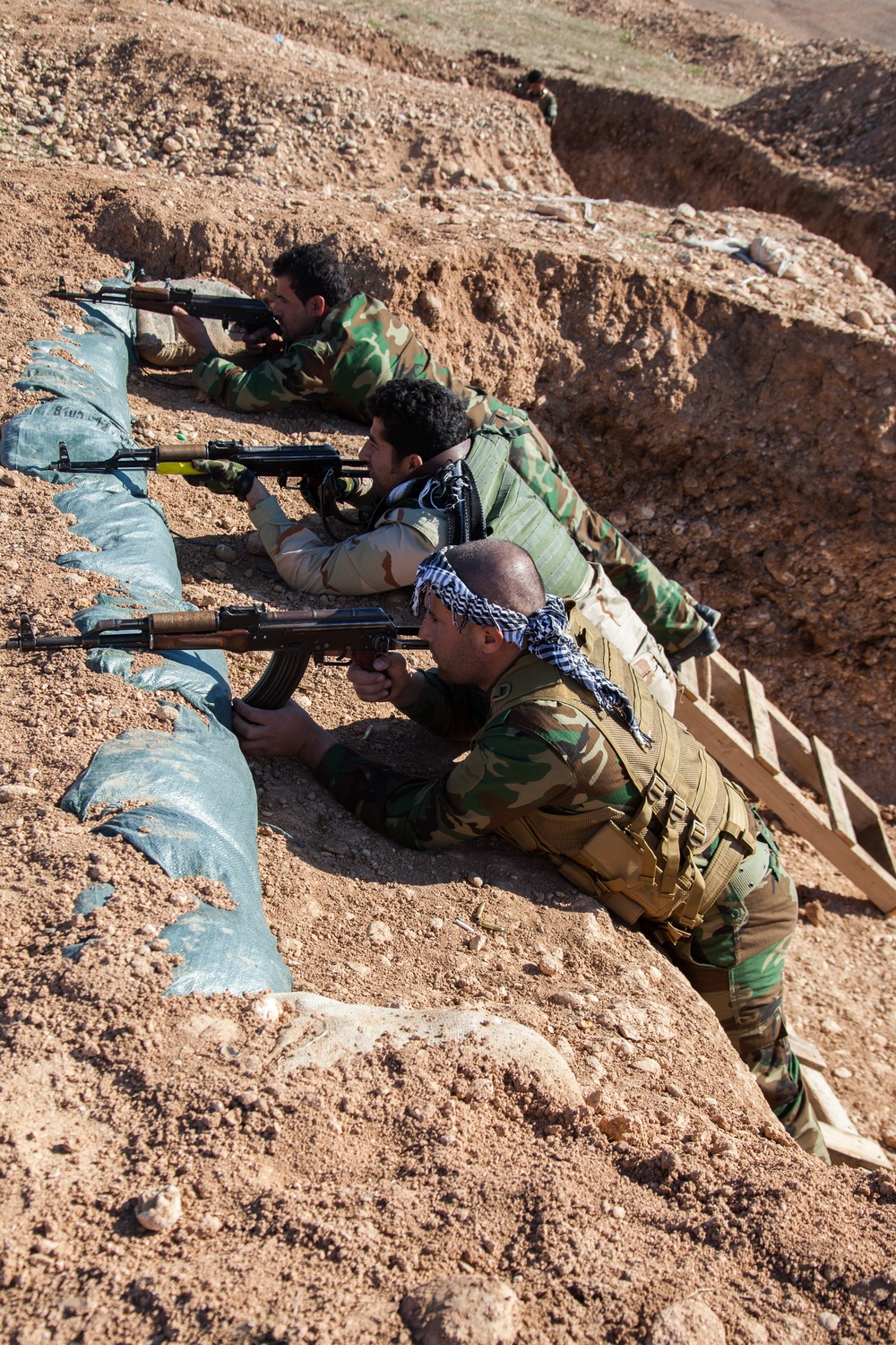 Peshmerga soldiers practice urban patrols and defense tactics under the supervision of German trainers