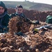 Peshmerga soldiers make fox holes and practice defensive tactical skills under the supervision of German trainers.