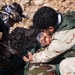 Peshmerga soldiers practice combat lifesaver skills under the supervision of German trainers