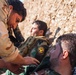 Peshmerga soldiers practice combat lifesaver skills under the supervision of German trainers