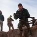 Peshmerga soldiers work through their validation assessment under the supervision of German trainers.