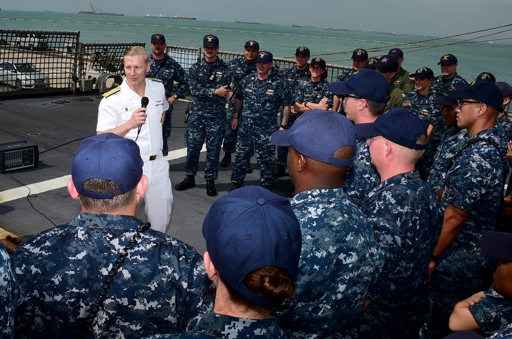 Vice Adm. Joseph P. Aucoin, Commander, US 7th Fleet, talks with Sailors during an all hands call aboard USS Fort Worth