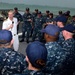 Vice Adm. Joseph P. Aucoin, Commander, US 7th Fleet, talks with Sailors during an all hands call aboard USS Fort Worth