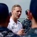 Vice Adm. Joseph P. Aucoin, Commander, US 7th Fleet, talks with Sailors during an all hands call aboard USS Fort Worth