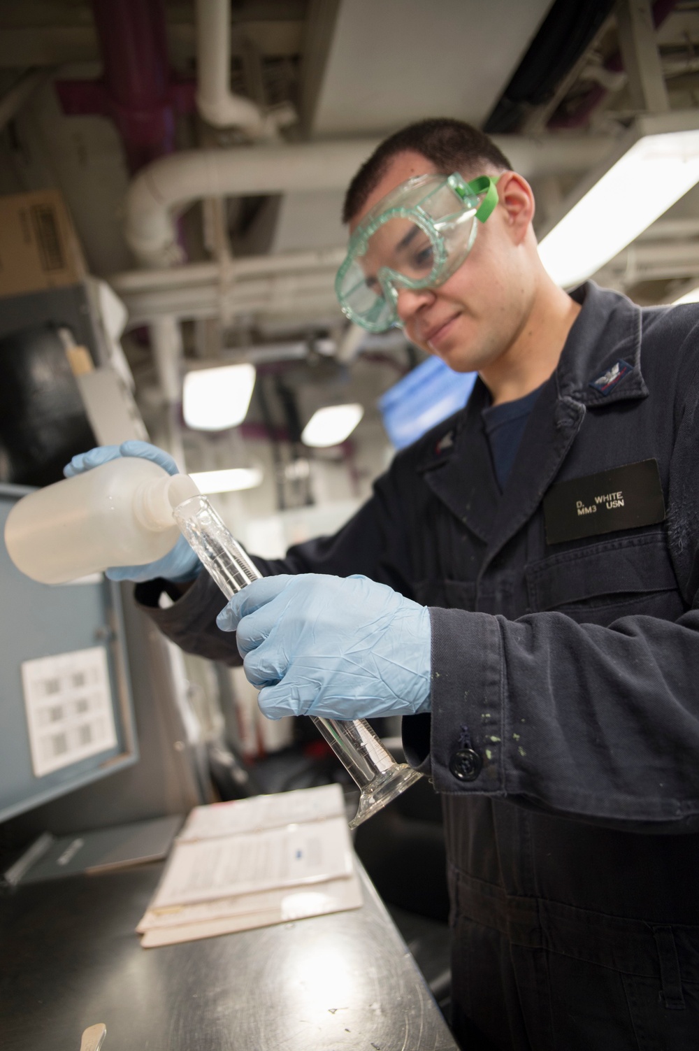 USS Bonhomme Richard sailor conducts boiler water test
