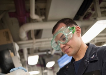 USS Bonhomme Richard sailor conducts boiler water test