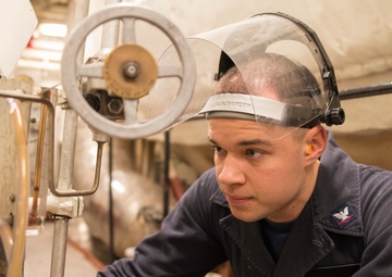 USS Bonhomme Richard sailor conducts boiler water test