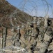 Brave Rifles Soldiers set up concertina wire