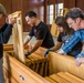 Volunteers help community bring a piece of history home