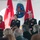 More than 200 brave rain and snow for memorial ceremony