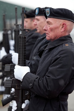 More than 200 brave rain and snow for memorial ceremony