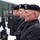 More than 200 brave rain and snow for memorial ceremony