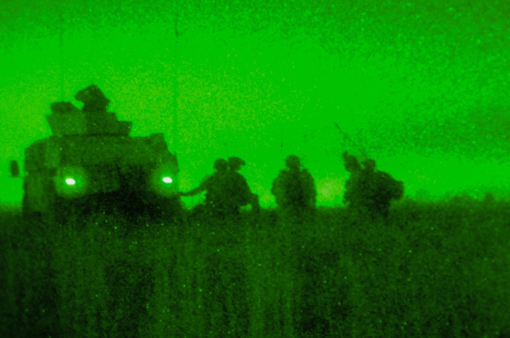 Paratrooper infantry does a night linkup