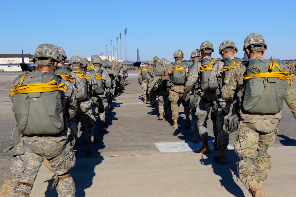 Paratroopers board an aircraft