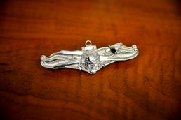 History made at GTMO: Coast Guardsman earns Navy warfare pin