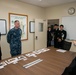 NAF Atsugi CO and JMSDF rear admiral view recovered artifacts