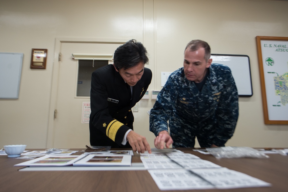 NAF Atsugi CO and JMSDF rear admiral view recovered artifacts