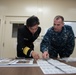 NAF Atsugi CO and JMSDF rear admiral view recovered artifacts
