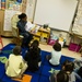 Sailor reads to elementary school at volunteer event