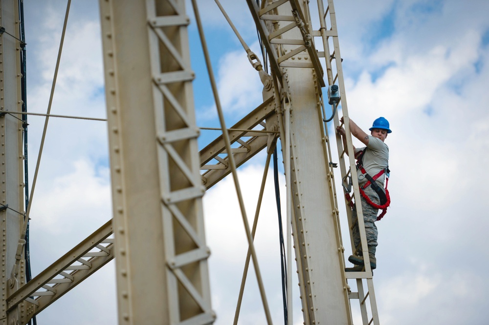 Going up: Airmen climb water tower