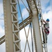 Going up: Airmen climb water tower